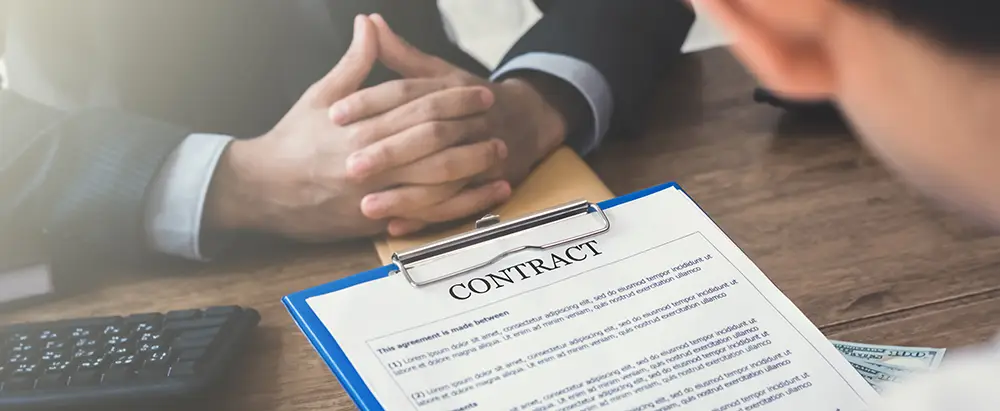 Business lawyer with contract papers