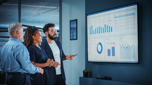 Family law marketing team discussing family law SEO strategies and client growth goals in office meeting. Contact EverConvert for all of you family law marketing needs. 