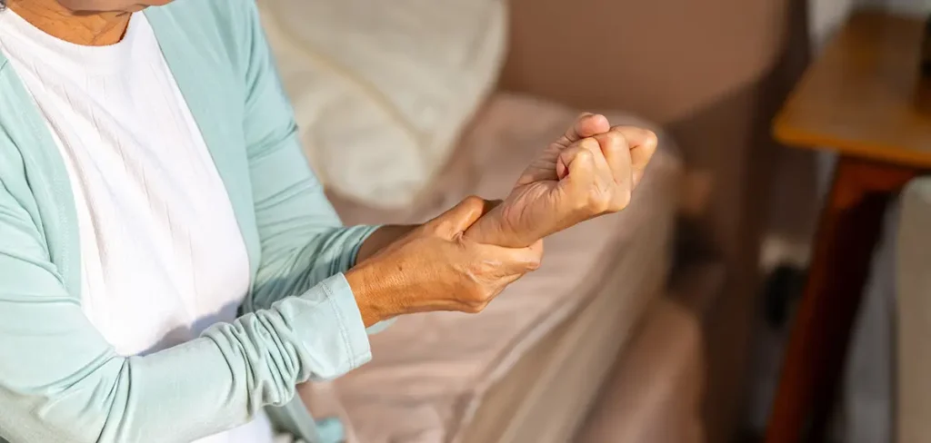 woman holding wrist in pain