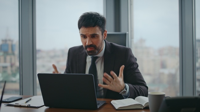 Personal injury lawyer frustrated by poor Google search rankings on laptop screen