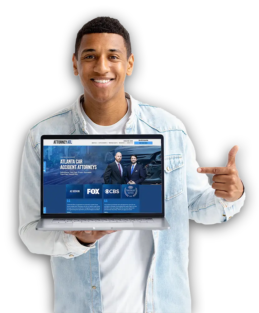 Man holding a laptop with law firm website on it