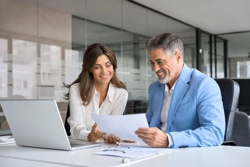 Planner and client reviewing trade services 