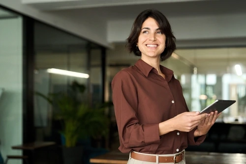 Woman at a marketing agency developing trade services marketing strategies for roofing and landscape businesses.