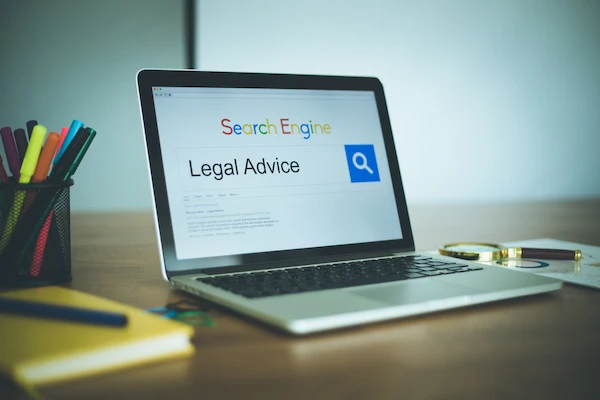 A laptop with the words legal advice on a search engine